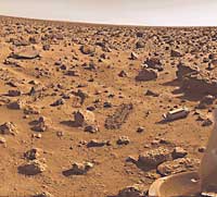The surface of Mars was sampled for signs of life by the Viking 2 lander in 1976. A mechanical sampling arm dug the grooves near the round rock at the lower left. The cylinder at the right covered the sampling device and was ejected after landing.