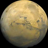 The Valles Marineris system of valleys is about 2,500 miles (4,000 kilometers) long -- roughly one-fifth the distance around the planet Mars. Parts of the system are 6 miles (10 kilometers) deep.