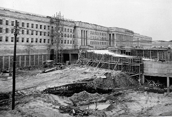 The Pentagon's facade nearing completion as work on one of the drives is underway